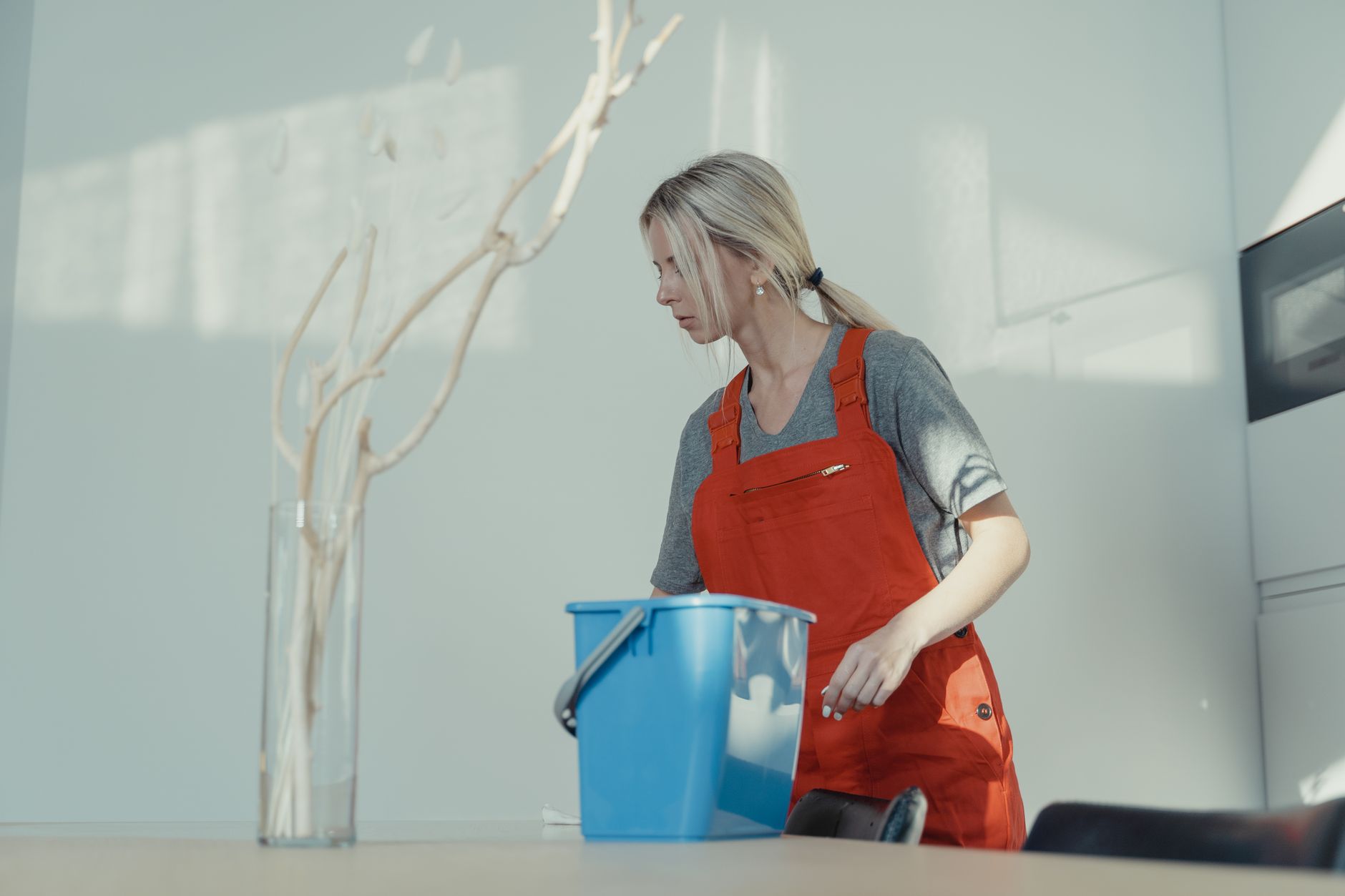 A Mrs. Clean team member clearing construction dust to a move-in standard